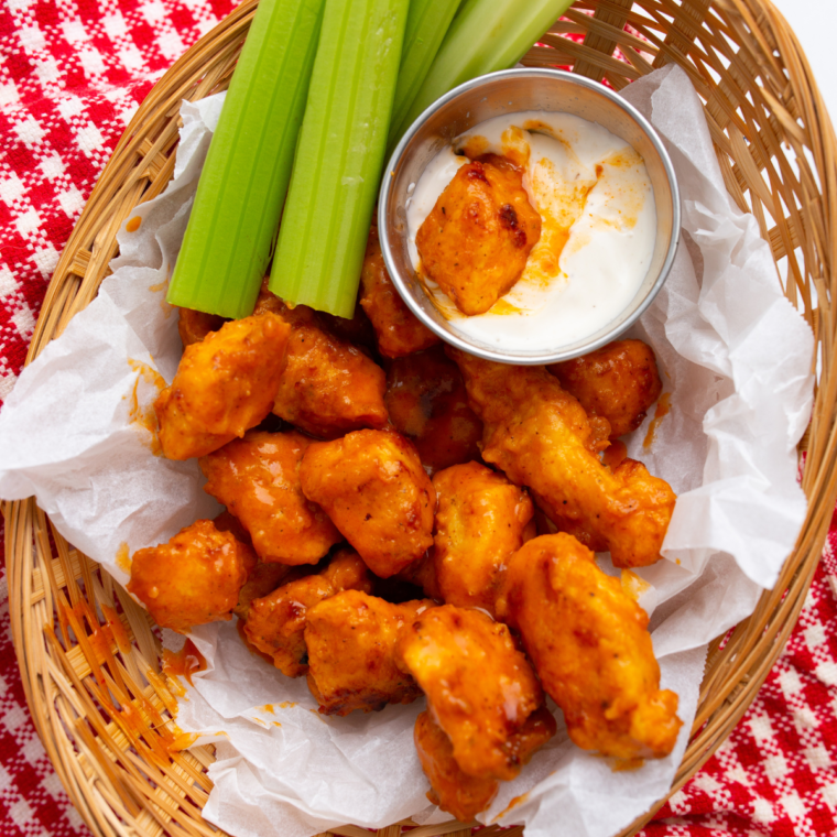 Close-up of crispy Longhorn spicy chicken bites glazed in honey hot sauce