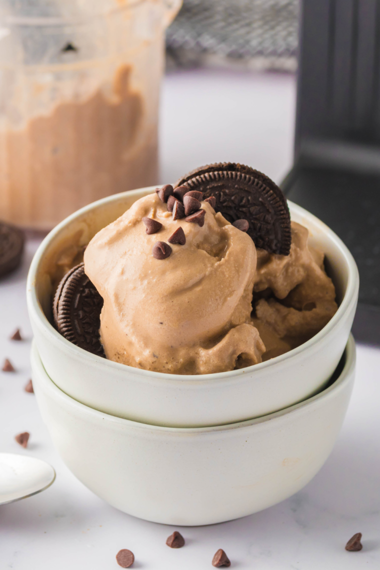 "Mocha Cookie Crumble Ice Cream served with a spoon and cookie crumbles"