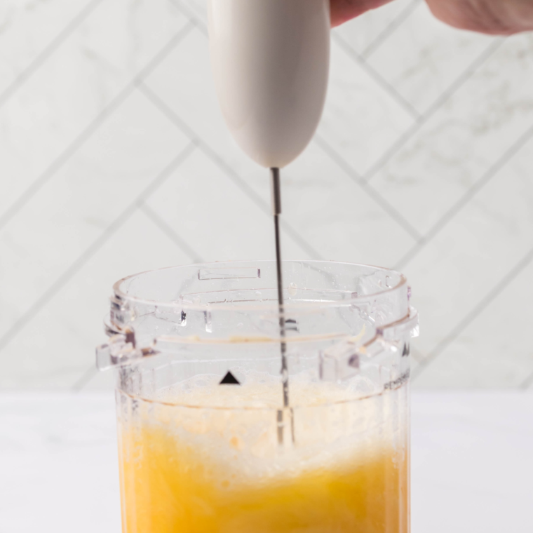 Blending sorbet mixture with an immersion blender.