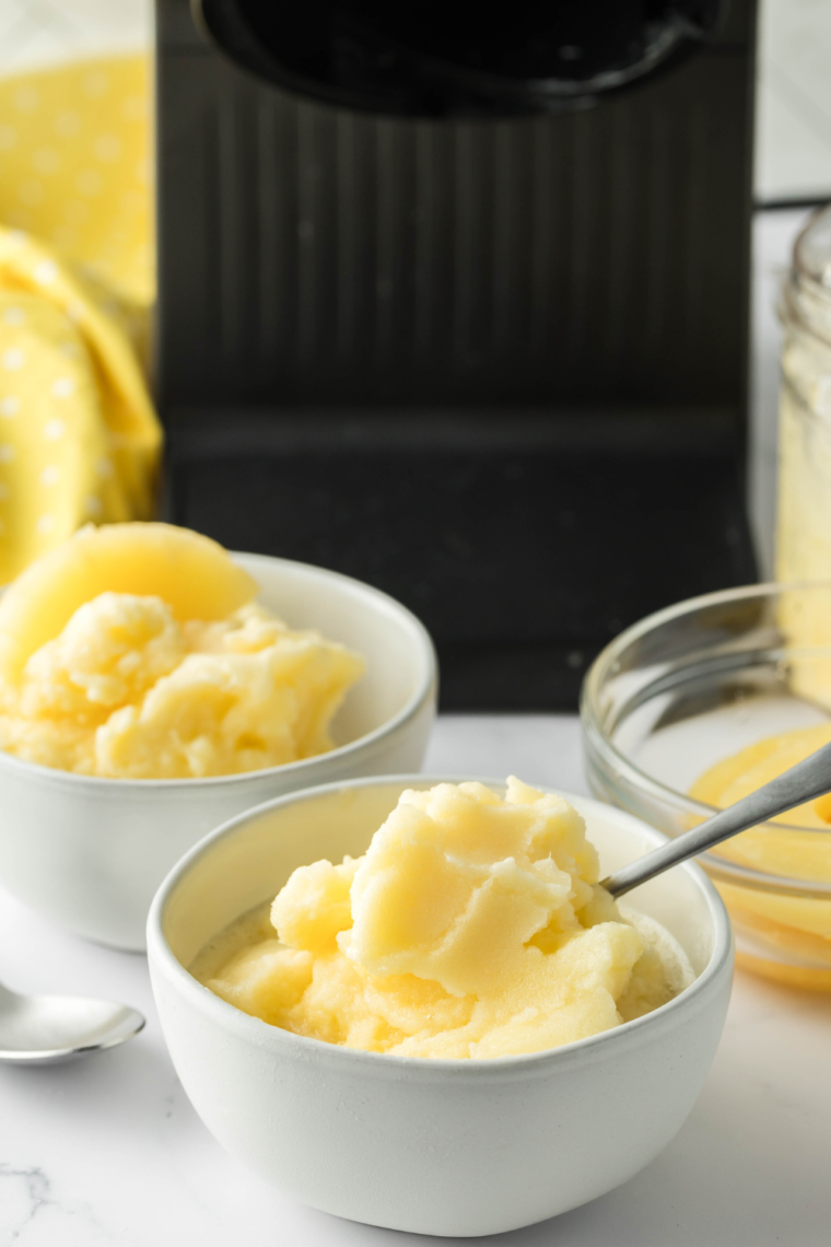 "Bowl of creamy Ninja Creami Pineapple Passionfruit Lemonade Sorbet with vibrant tropical flavors"