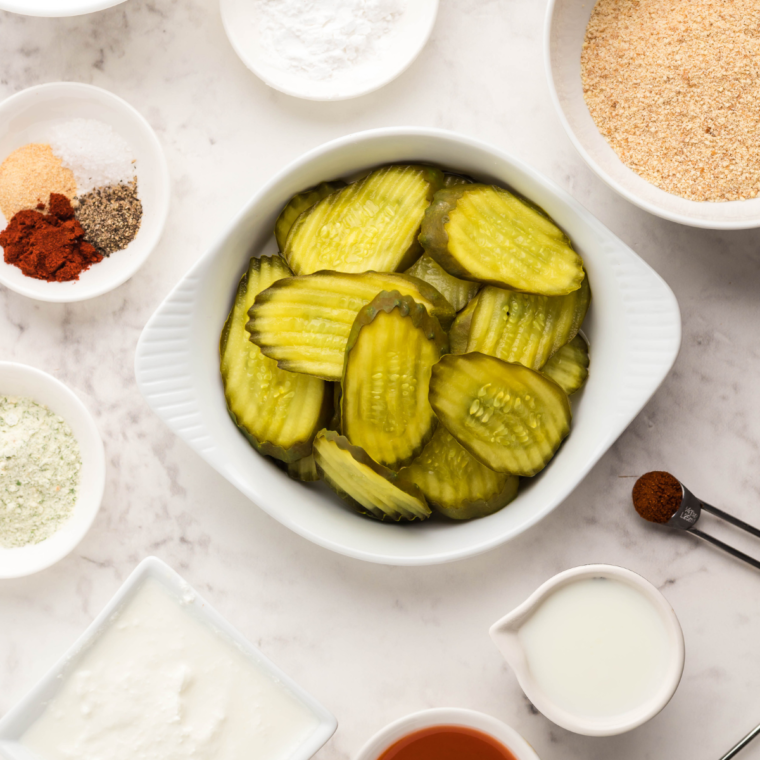 Ingredients needed for Air Fryer Copycat Red Robin Pickle Nickels on kitchen table.