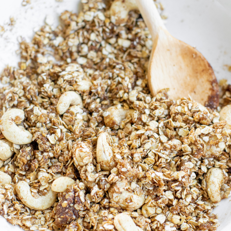 Protein granola mixture evenly coated and ready for the air fryer basket.