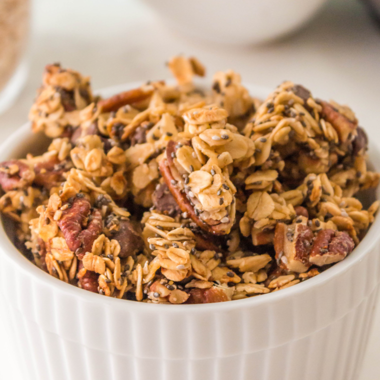 Air fryer granola without coconut oil, featuring oats, nuts, and maple syrup for a crunchy, healthy treat.