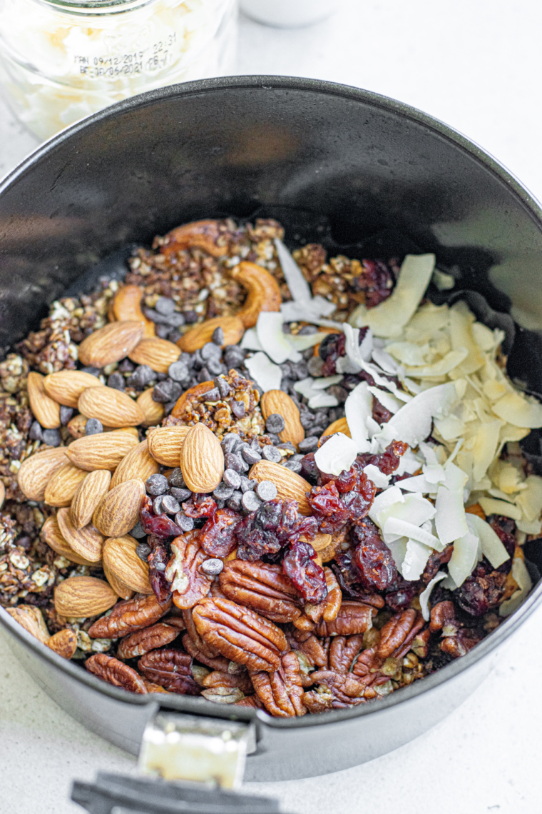 Air fryer protein granola served over yogurt with fresh berries.