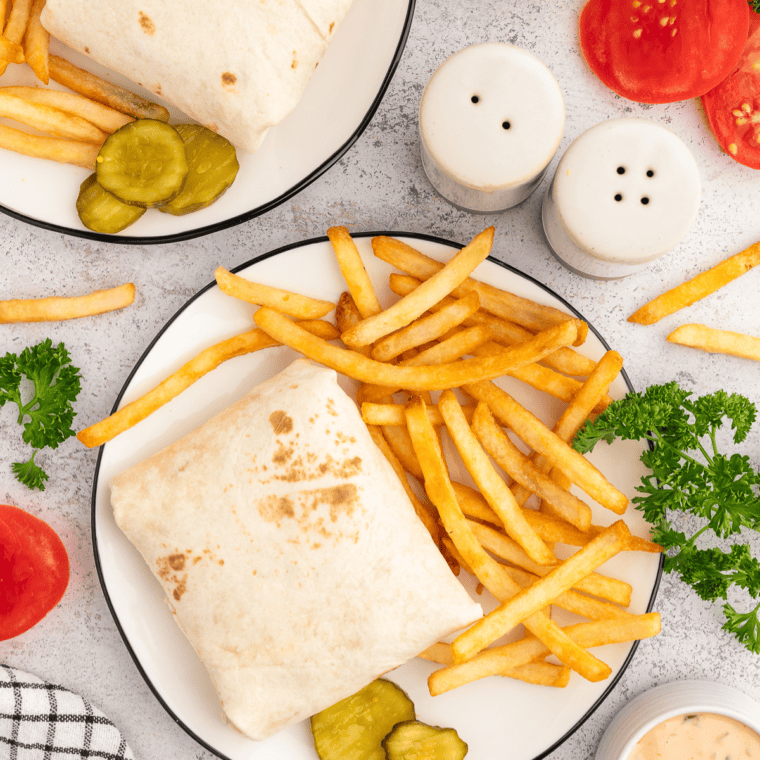 Copycat In-N-Out Burger Wrap with melted cheese, lettuce, tomato, pickles, and In-N-Out-style sauce wrapped in a crispy tortilla.