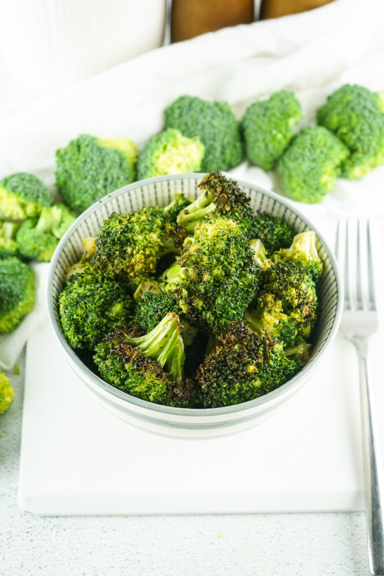 Copycat Longhorn Steakhouse broccoli served alongside a steakhouse dinner.
