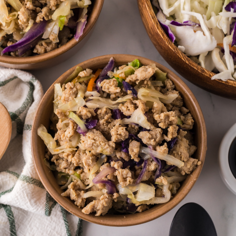 Ninja Foodi Chicken Egg Roll Bowls served in a bowl with chicken, shredded vegetables, and a flavorful sauce.