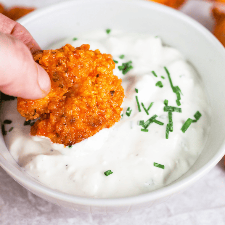 Outback Steakhouse Blue Cheese Dressing served with spicy shrimp for a delicious meal.