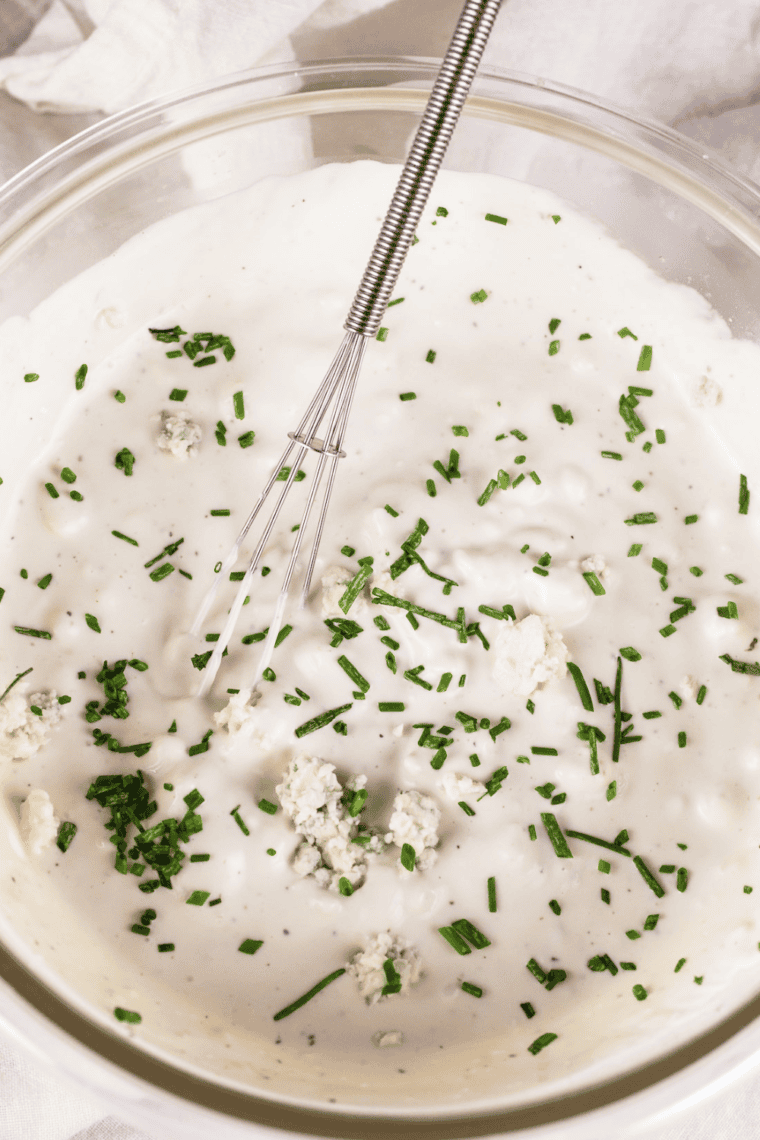 Step-by-step process of making Texas Roadhouse Blue Cheese Dressing, including mixing mayonnaise, sour cream, buttermilk, and crumbled blue cheese.