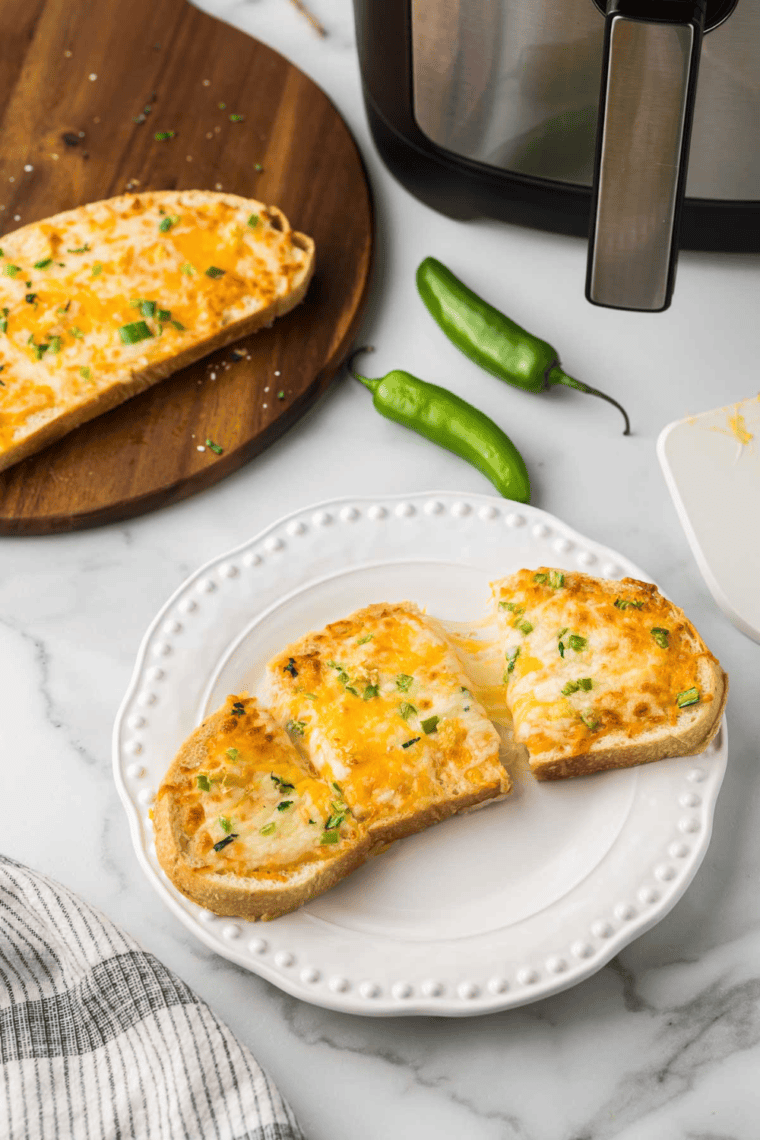 A plate of Air Fryer Chile Cheese Toast slices ready to serve as a snack or appetizer