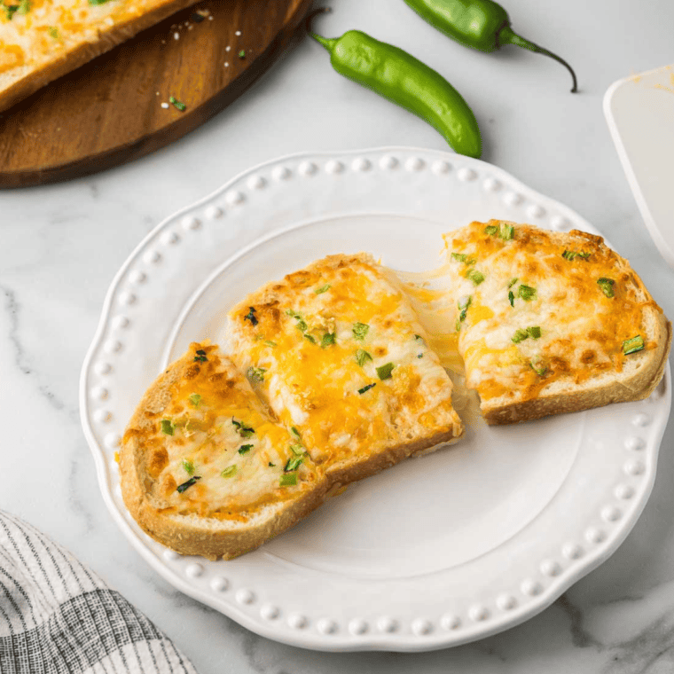 Crispy sourdough air fryer chile cheese toast with melted mozzarella, cheddar, and serrano peppers