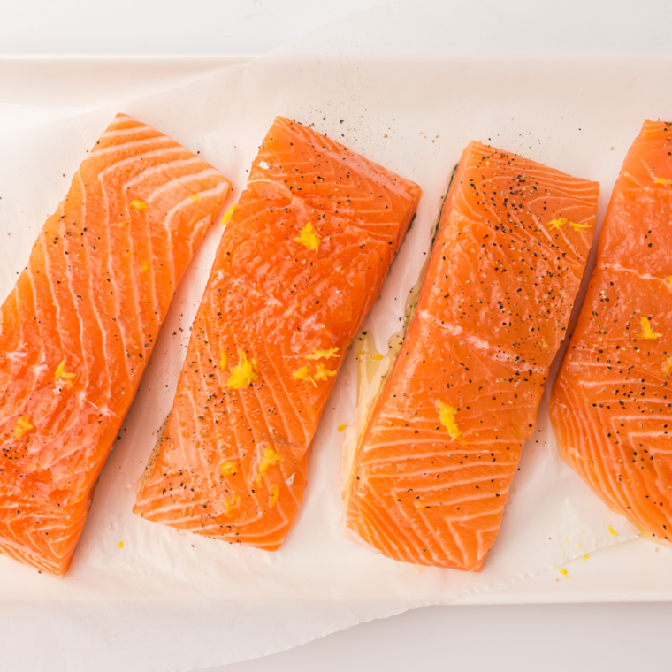 Seasoned salmon fillets resting before air frying to absorb the marinade
