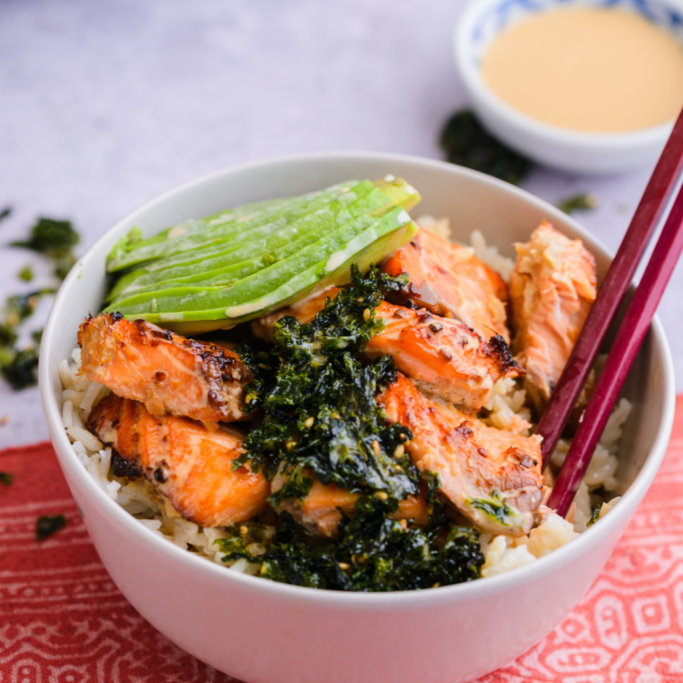Air fryer salmon meal-prep bowl with rice, veggies and salmon in a glass container