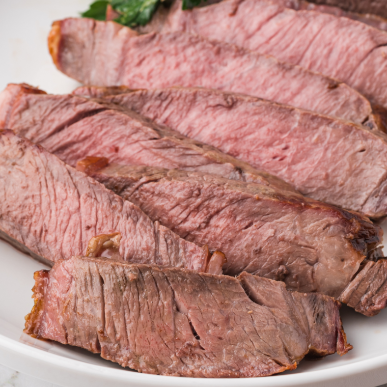 Homemade Texas Roadhouse Steak Sauce served with grilled steak.
