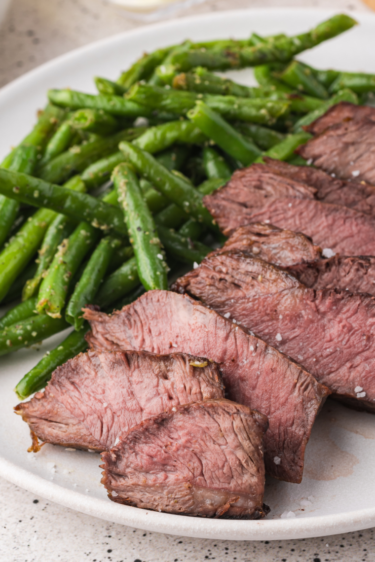 Homemade Texas Roadhouse Steak Sauce in a bowl with ingredients like butter, Worcestershire sauce, and tomato paste.