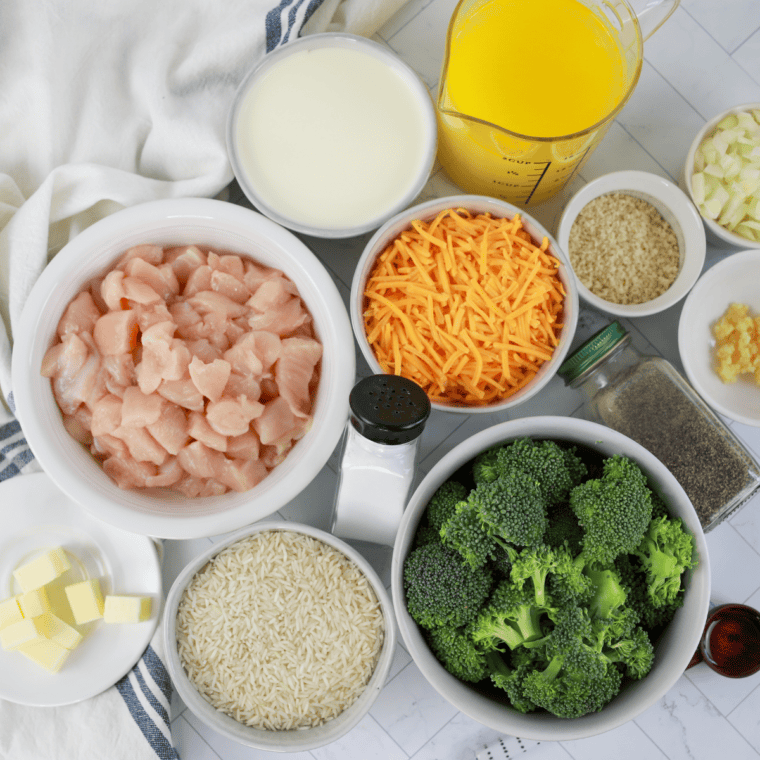 Ingredients for chicken and broccoli casserole: diced chicken, rice, broccoli, cheddar, cream, and panko