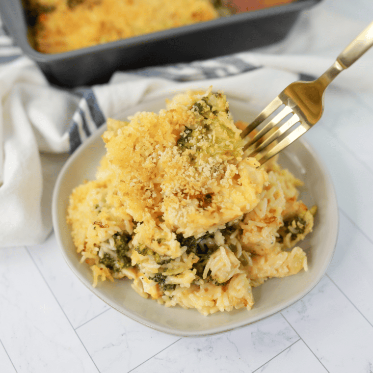 Air fryer chicken and broccoli casserole with a golden panko topping in a white baking dish