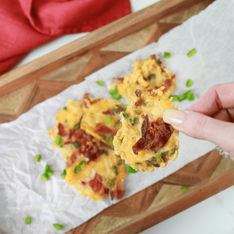 Finished Air Fryer Jalapeño Popper Crisps cooling on parchment, crisp and golden brown.