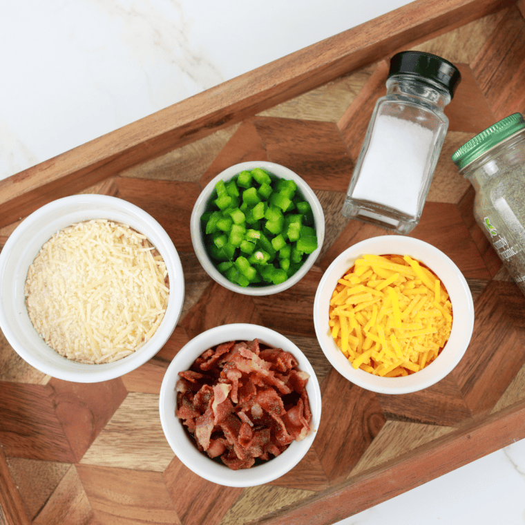 Ingredients for Air Fryer Jalapeño Popper Crisps: parmesan, cheddar, bacon, fresh jalapeño, salt, and pepper.