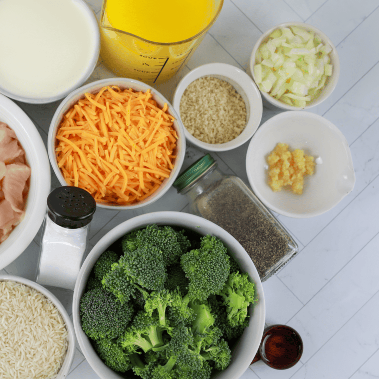 Ingredients for Cheddar's broccoli cheese casserole: rice, broccoli, Velveeta, butter, cream of mushroom soup, milk, and Ritz crackers