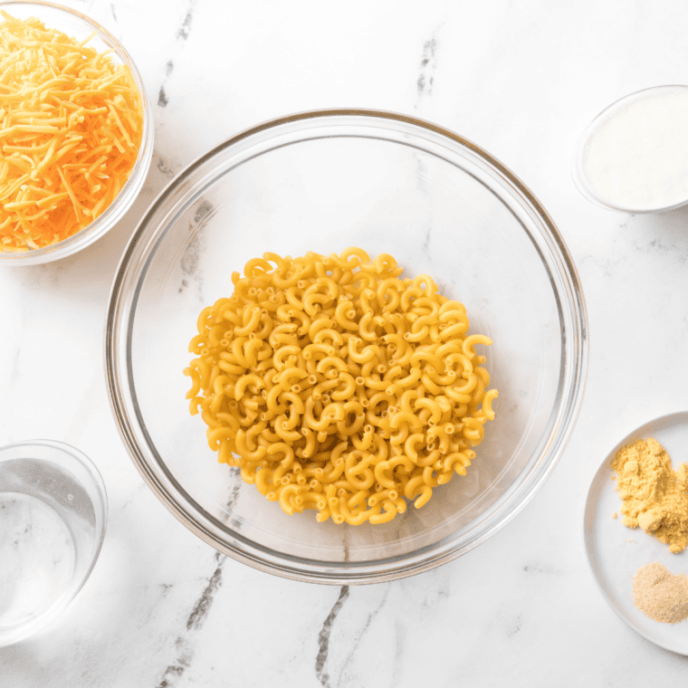 Ingredients needed for Popeyes Mac and Cheese Copycat Recipe on kitchen table.