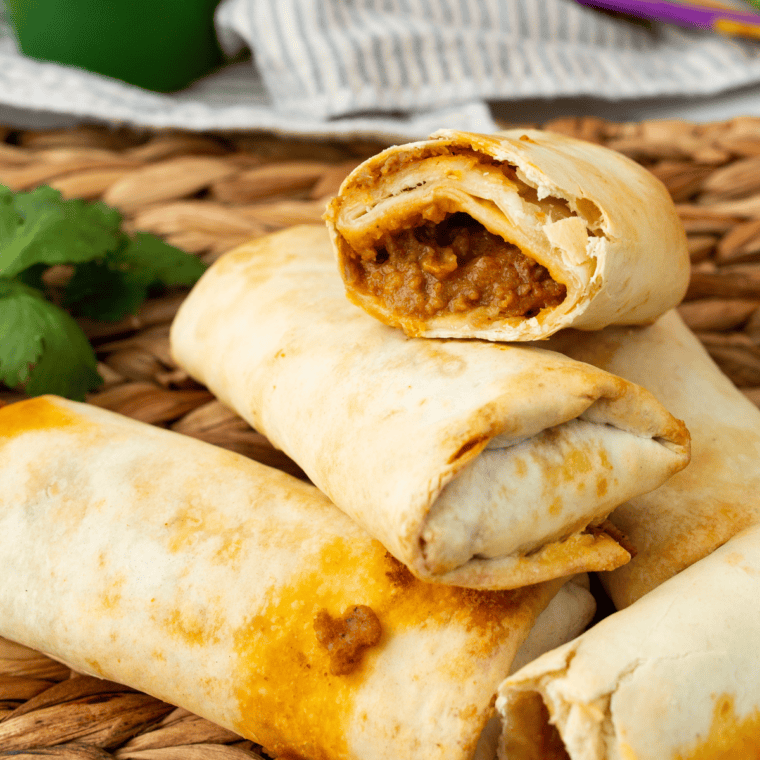 Golden, crispy Air Fryer Beef Chimichangas filled with seasoned beef and cheese, served with salsa and sour cream
