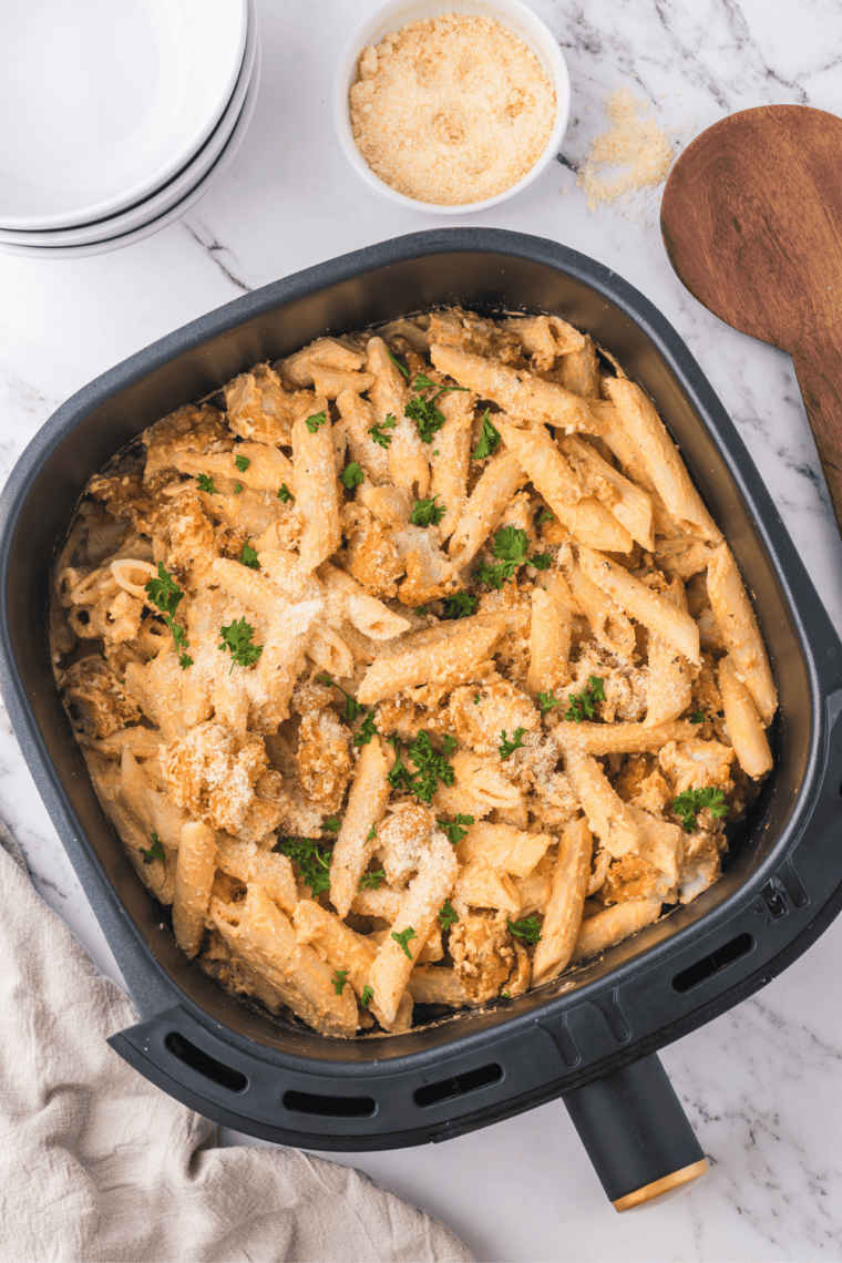 Air fryer buffalo chicken pasta with crispy chicken, creamy sauce, and pasta.
