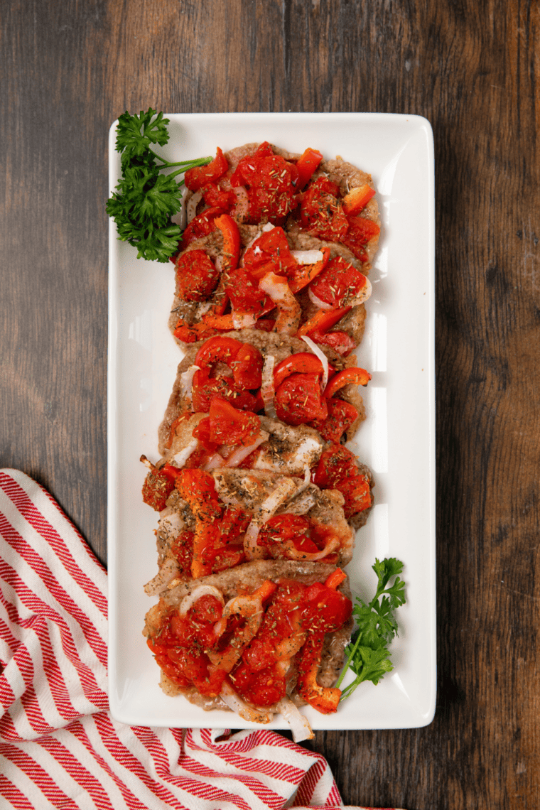 Tender Air Fryer Swiss steak with tomato gravy and vegetables.