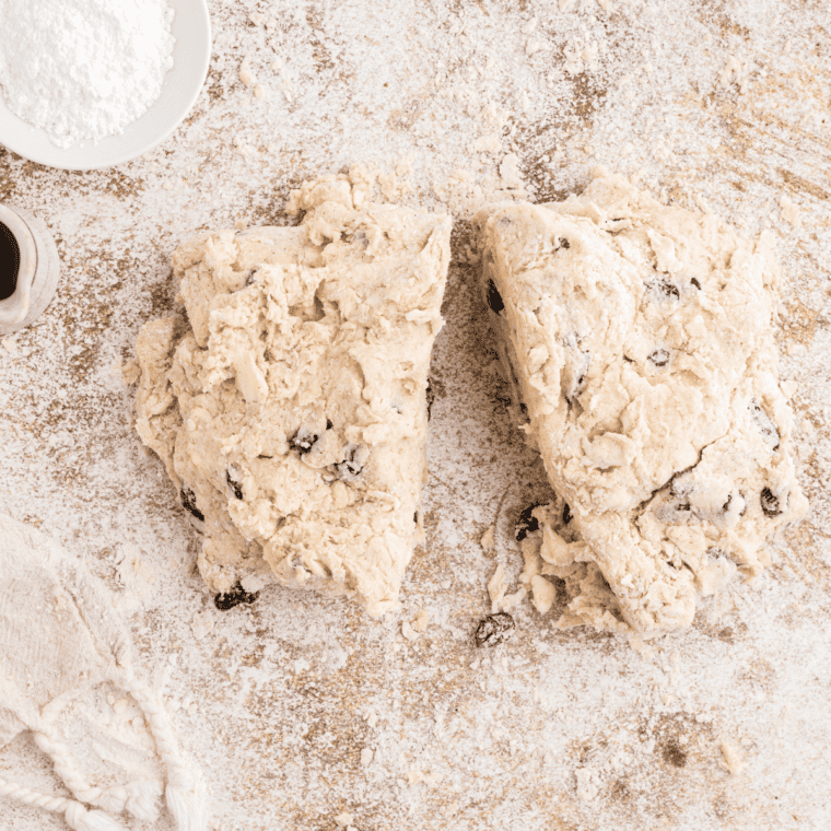 Rolling out biscuit dough to 1-inch thickness and cutting into rounds or wedges.