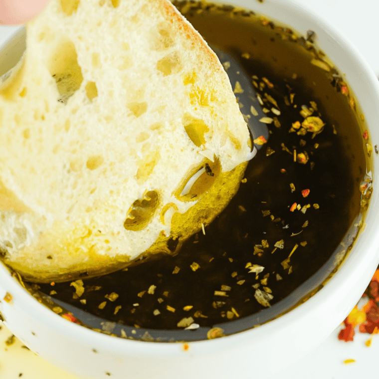 Johnny Carino’s Olive Oil Dip with fresh herbs, garlic, and Parmesan cheese served with bread.