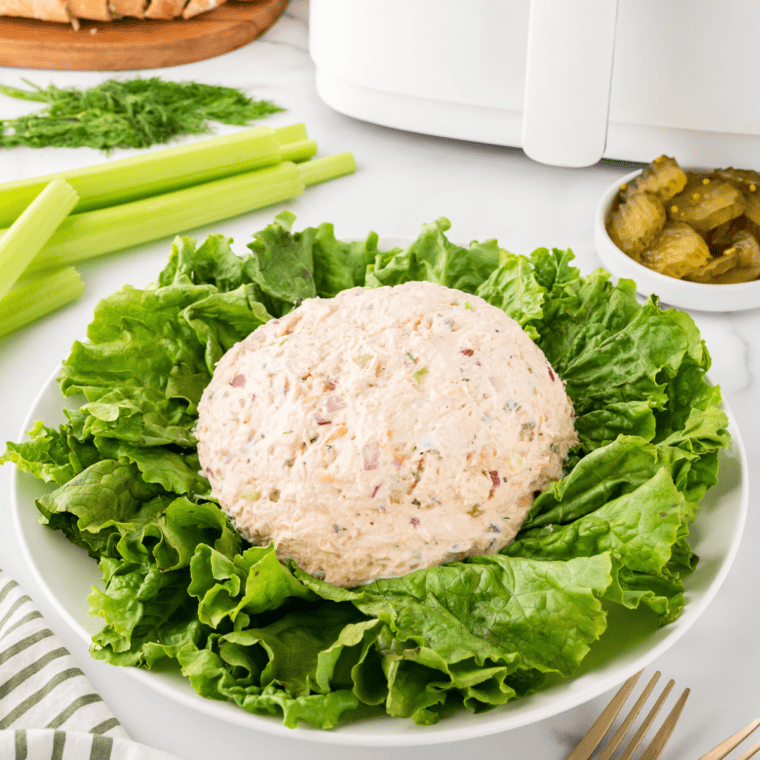Bowl of homemade Napa Almond Chicken Salad with chicken, almonds, grapes, and celery in a creamy dressing.
