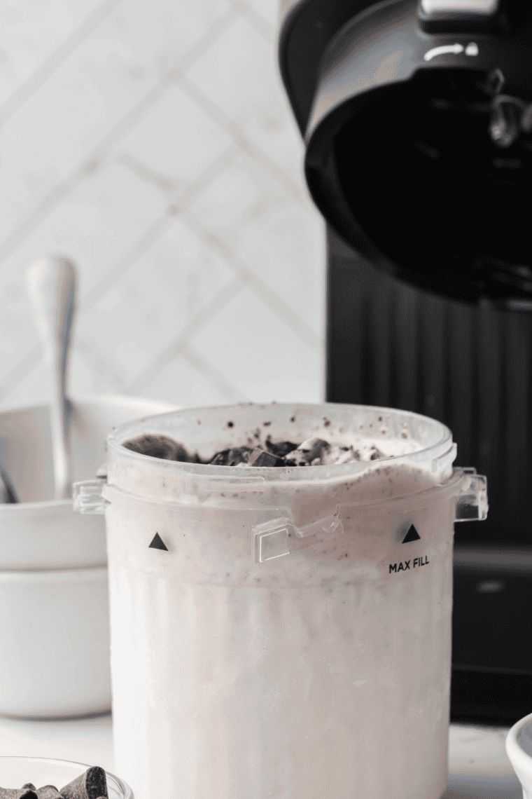 Process frozen mixture in Ninja Creami on 'Ice Cream' setting.