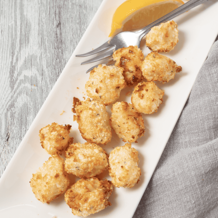 Golden and crispy Air Fryer Breaded Scallops served with dipping sauce on the side.