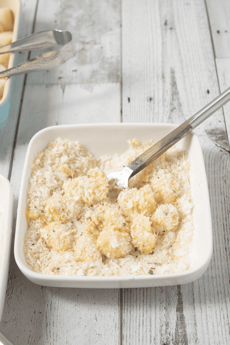 Flour-coated scallops dipped in egg and tossed in seasoned panko mixture for even coating.