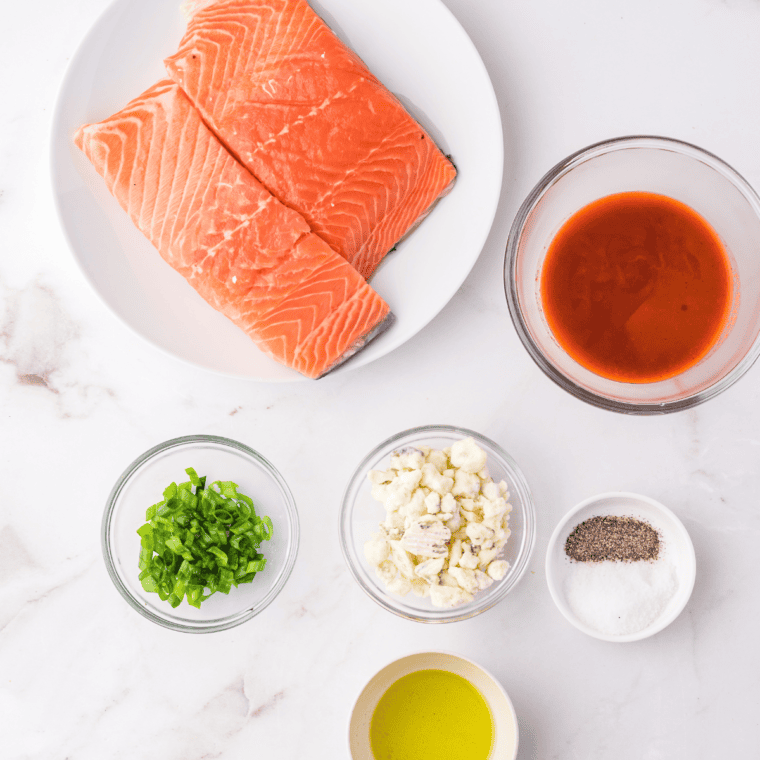 Ingredients needed for Air Fryer Buffalo Salmon on kitchen table.
