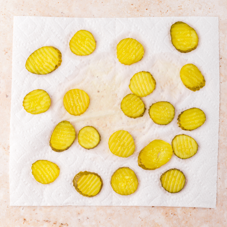 Dry the pickles on a paper towel.