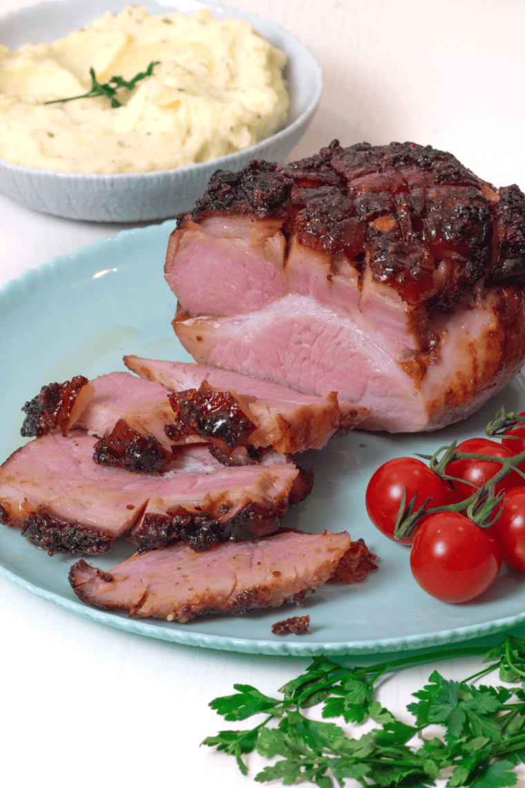 Juicy sliced air fryer gammon roast with golden glazed crust, ready to serve.
