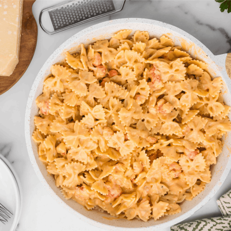 Pasta mixed with langoustine tails, topped with shaved Parmesan cheese and fresh parsley.