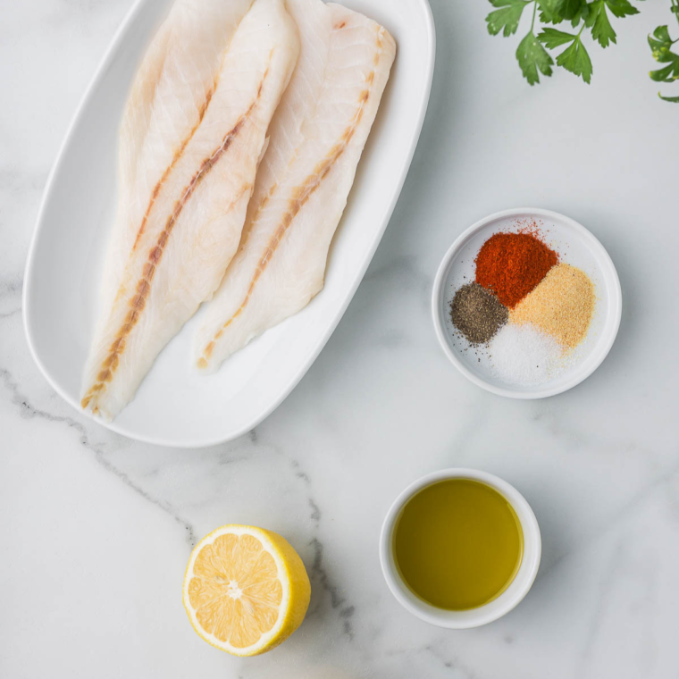Ingredients needed for Air Fryer Orange Roughy on kitchen table.