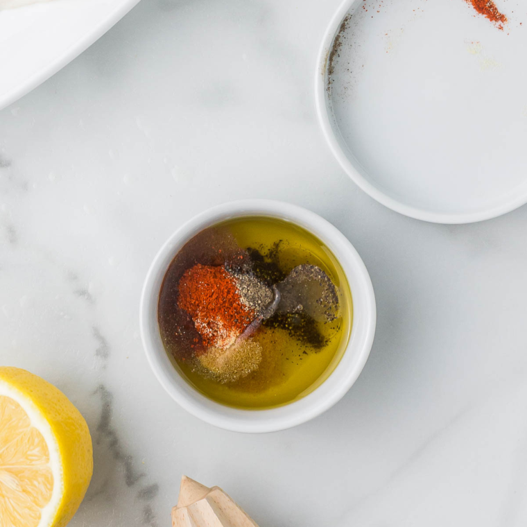 In a small bowl add the seasonings and olive oil, mix together, for a flavorful coating for the fish.