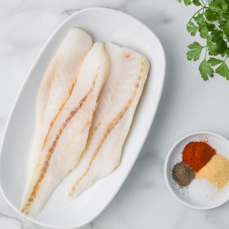 Using a paper towel or clean kitchen towel, pat the fish dry.