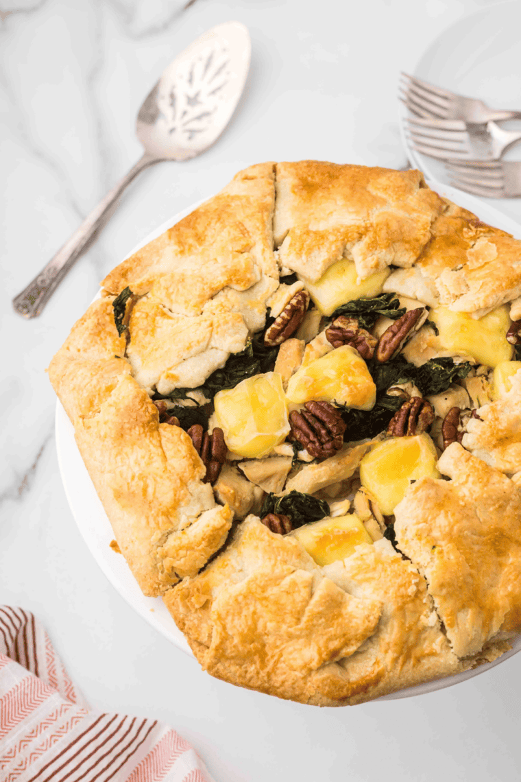 Rustic chicken tart with golden puff pastry, creamy filling, and cherry tomatoes, served fresh from the air fryer