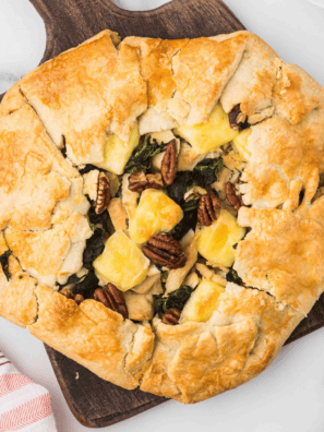 Golden-brown rustic chicken tart with puff pastry, cherry tomatoes, and herbs cooked in an air fryer
