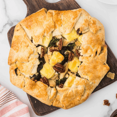 Golden-brown rustic chicken tart with puff pastry, cherry tomatoes, and herbs cooked in an air fryer