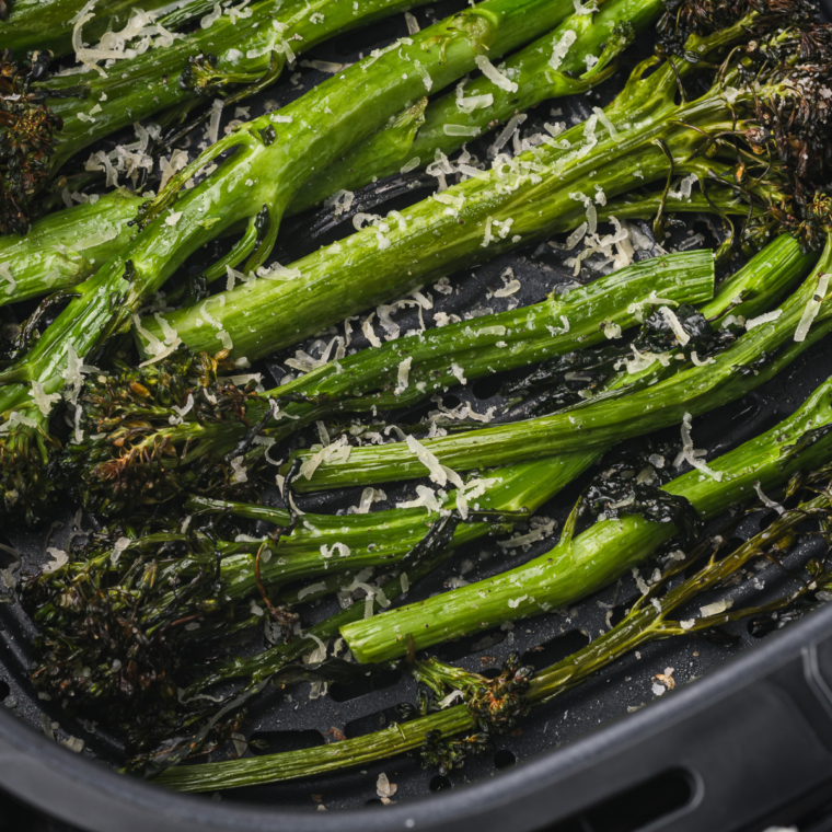 Air-fried tenderstem broccoli served crispy and golden, garnished with seasonings.