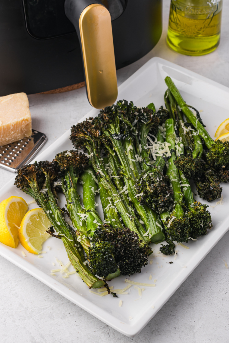 Air-fried tenderstem broccoli, golden and crispy, served with a light seasoning.