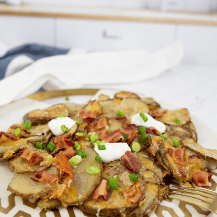 Crispy homemade Blackstone potato chips served in a white bowl, golden brown with a perfect crunch