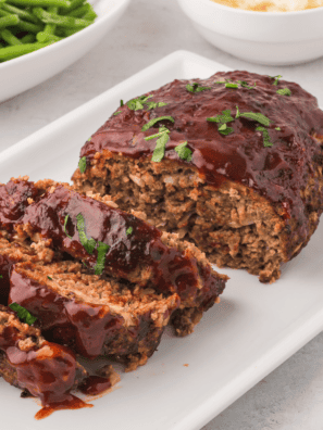 Delicious homemade Copycat Cracker Barrel Meatloaf served with mashed potatoes and sides