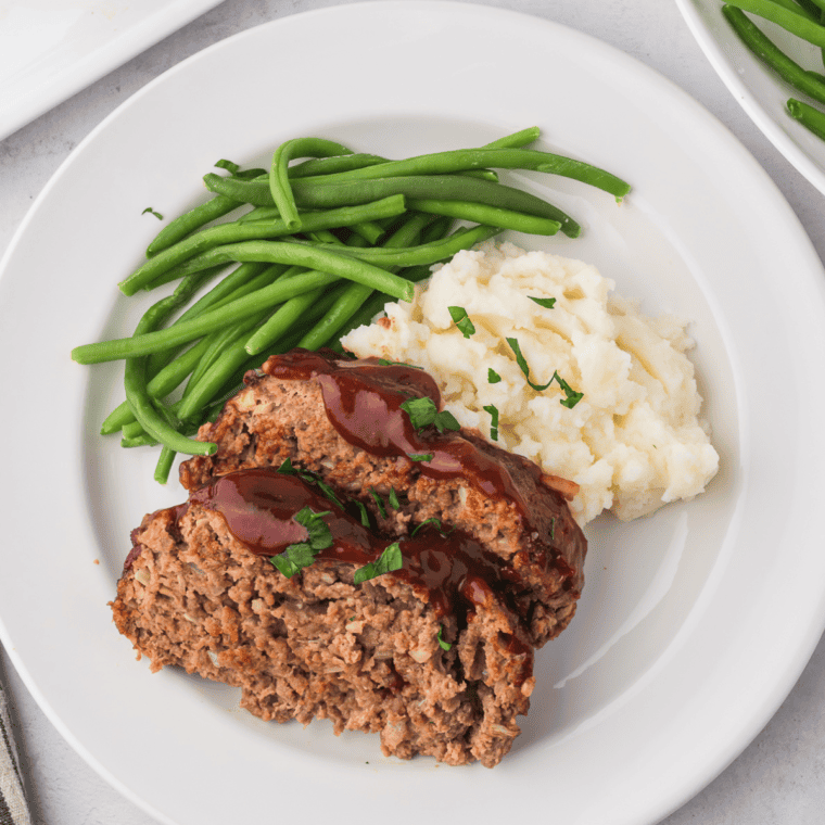 Delicious homemade Copycat Cracker Barrel Meatloaf served with mashed potatoes and green beans