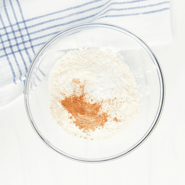In a large bowl, whisk together: Flour, Sugar, Baking soda, Baking powder, Salt, Cinnamon, and nutmeg.
